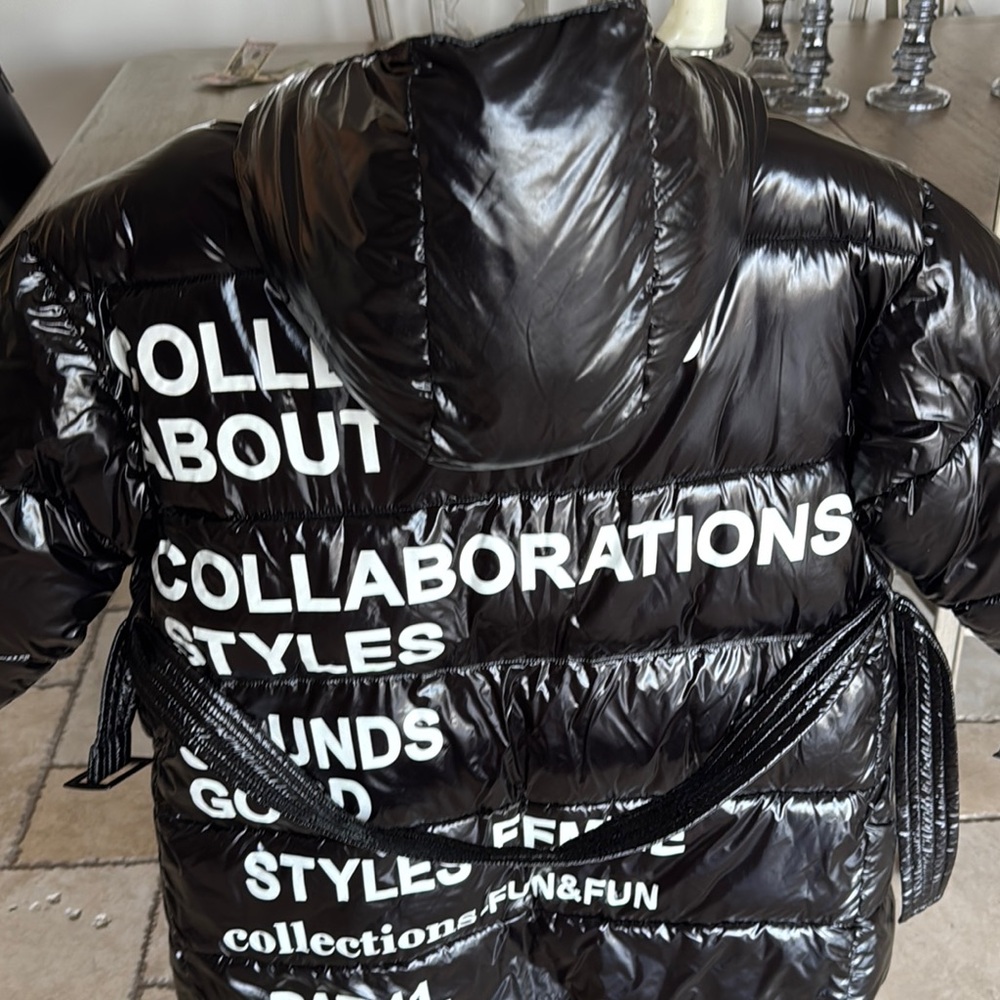 Black Puffer Jacket with White Text